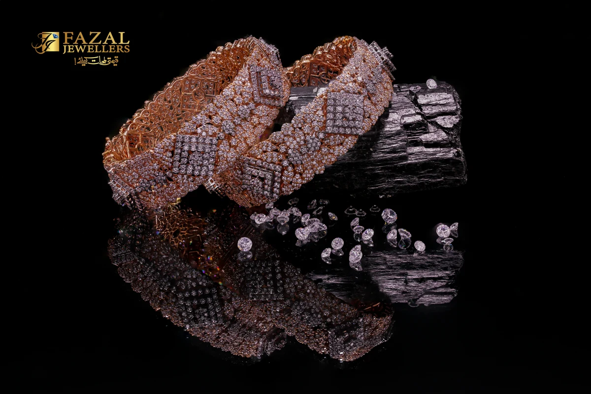 Diamond bracelets on a dark reflective surface with scattered gemstones