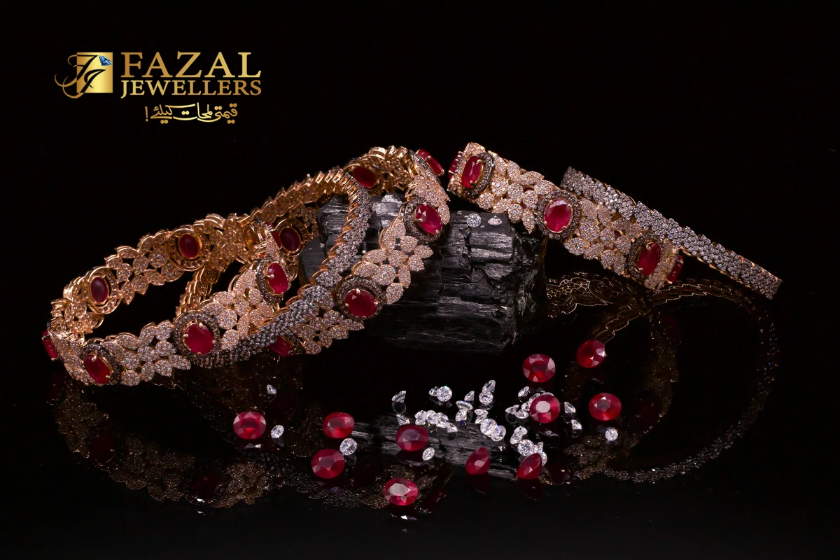 Ruby and diamond bangles on a reflective black studio set